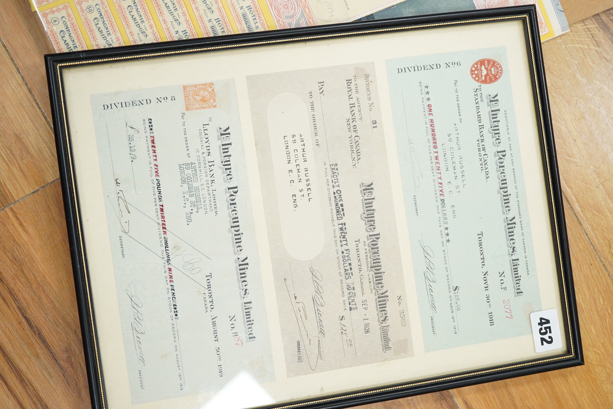 Share certificates, two framed to include McIntyre Porcupine Mines Ltd